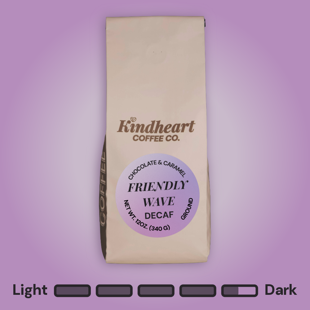 Kindheart Coffee Co. Friendly Wave Decaf Ground coffee bag on an purple background with Dark Roast bubbles 4.5 out of 5 roast level.